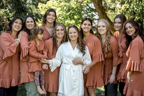 Elegant bridal party portraits with bridesmaids in soft summer tones and groomsmen in classic suits at Gastler Farm.'
