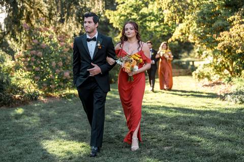 Elegant bridal party portraits with bridesmaids in soft summer tones and groomsmen in classic suits at Gastler Farm.'
