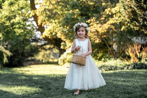 The flower girl steals the show, tossing petals with a big smile during the bridal party procession in Durham, CT.'