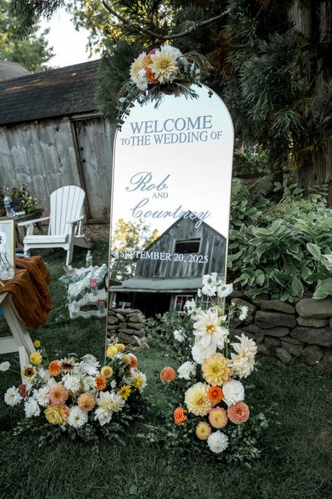 Creative detail shot of the bride’s bouquet resting on vintage wood, an artistic highlight of Gastler Farm’s rustic wedding vibe.'