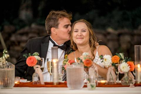 Guests cheer with champagne in hand as the couple shares a heartfelt toast at their reception in Durham, Connecticut.'