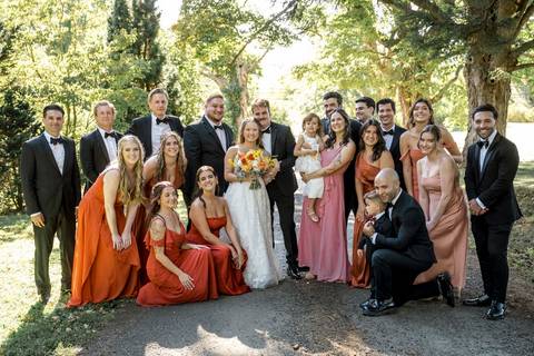 Elegant bridal party portraits with bridesmaids in soft summer tones and groomsmen in classic suits at Gastler Farm.'