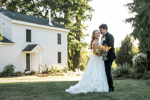 A quiet moment with family pictures, capturing natural smiles and tender embraces at a farm wedding in Durham, CT'