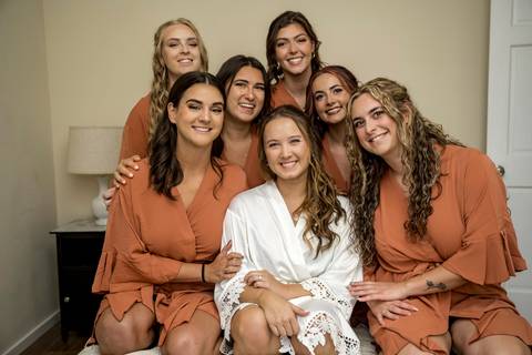 Elegant bridal party portraits with bridesmaids in soft summer tones and groomsmen in classic suits at Gastler Farm.'