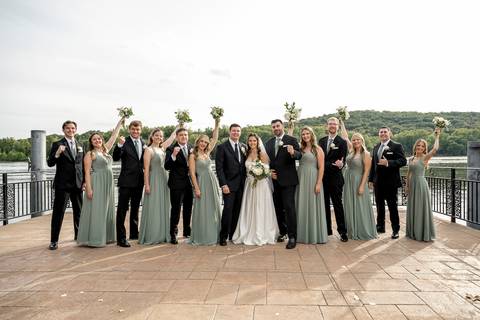 At the marina, bridesmaids and groomsmen gather under bright afternoon sun. The mood is relaxed, playful, and filled with laughter against a scenic waterfront backdrop.
Vanessa Trettel Photography'