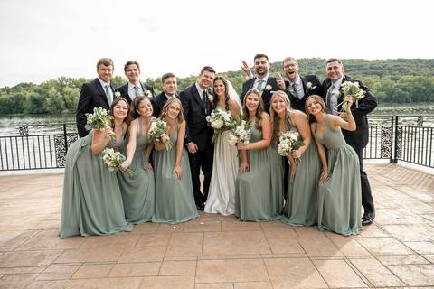 Another group shot captures movement and candid smiles, the wind lightly catching dresses and suits, adding a dynamic and natural feel.
Vanessa Trettel Photography'
