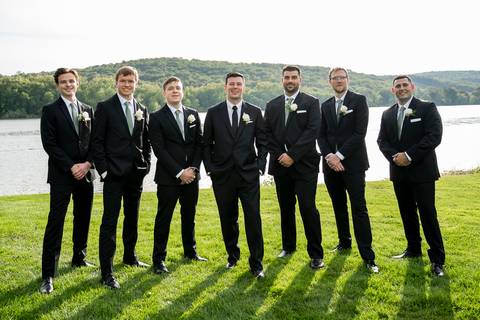 The groom stands confidently with his groomsmen, relaxed and smiling. Their camaraderie is effortless, reflecting years of friendship.
Vanessa Trettel Photography'