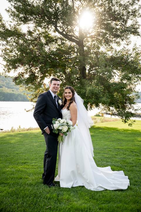 At sunset by the river, the couple stands close, bathed in golden light. The scene feels cinematic, quiet, and deeply romantic.
Vanessa Trettel Photography'