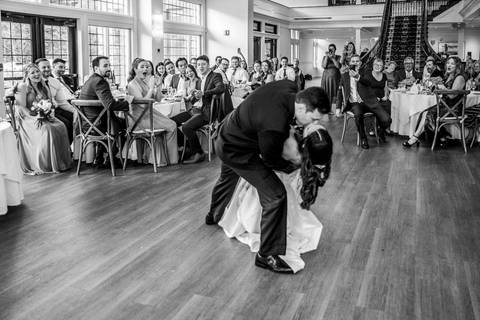 In black and white, the couple shares their first dance, surrounded by soft light and emotion, creating a timeless and elegant image.
Vanessa Trettel Photography'