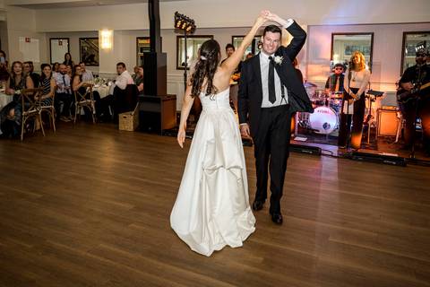 The live band energizes the dance floor as the couple dances, laughter and movement filling the frame.
Vanessa Trettel Photography'