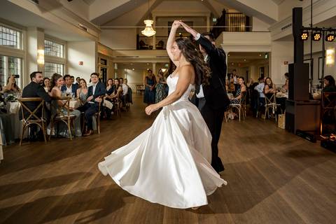 The groom pulls her close as they dance, creating a playful and intimate moment under warm lighting.
Vanessa Trettel Photography'