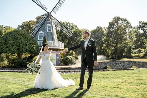 Artistic couple portraits: Jeffrey & Kiara stealing a kiss while strolling through the stunning Aqua Turf Club garden. Pure romance in Plantsville, CT.'
