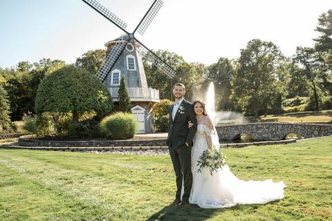 Artistic couple portraits: Jeffrey & Kiara stealing a kiss while strolling through the stunning Aqua Turf Club garden. Pure romance in Plantsville, CT.'