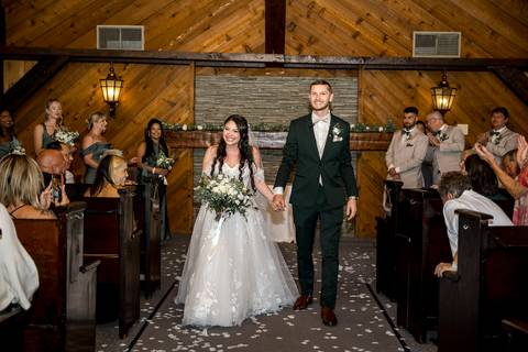 You may now kiss the bride! First kiss as husband and wife inside the Aqua Turf Club chapel. Pure joy captured!'