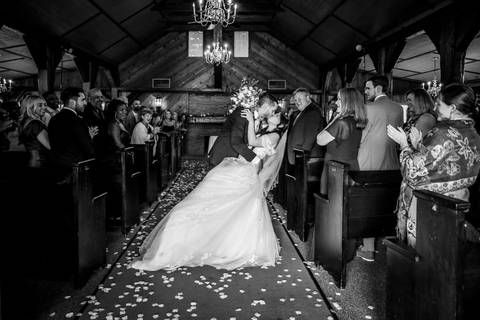 You may now kiss the bride! First kiss as husband and wife inside the Aqua Turf Club chapel. Pure joy captured!'
