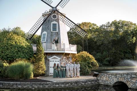 Guests mingling and celebrating the happy couple during the lively cocktail hour at the Aqua Turf Club. Fun New England wedding photography.'