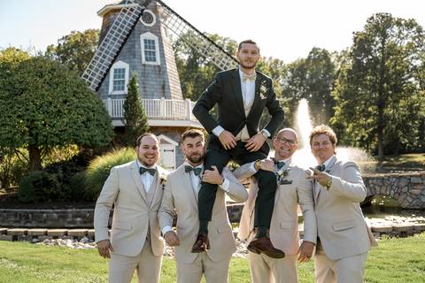 Jeffrey and his Groomsmen relaxing before the ceremony. Sharp suits and high spirits at the beautiful Aqua Turf Club grounds.'