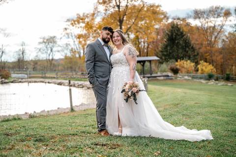 Bride and groom framed by rustic scenery at Nuzzo’s Farm by Vanessa Trettel, CT Wedding Photographer serving NY'