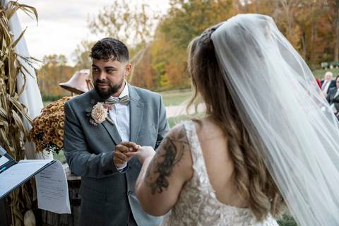 Bride and groom exchanging rings during emotional ceremony at Nuzzo’s Farm by Vanessa Trettel, CT Wedding Photographer serving NY'