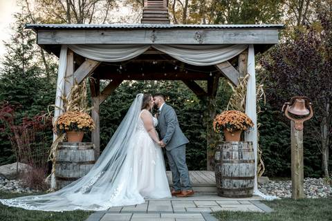First kiss as husband and wife during outdoor ceremony at Nuzzo’s Farm by Vanessa Trettel, CT Wedding Photographer serving NY'