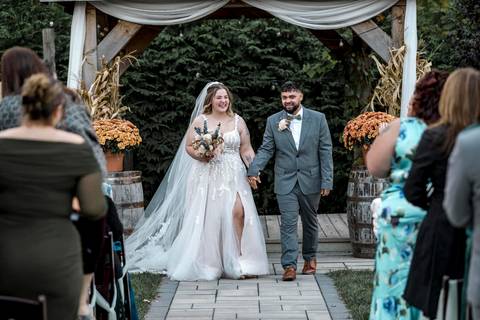 Bride and groom walking together after saying I do at Nuzzo’s Farm by Vanessa Trettel, CT Wedding Photographer serving NY'