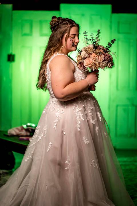 Bride adjusting her wedding dress in soft window light at Nuzzo’s Farm, photographed by Vanessa Trettel, CT Wedding Photographer serving NY'