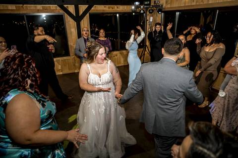 Bride and groom dancing surrounded by guests at Nuzzo’s Farm by Vanessa Trettel, CT Wedding Photographer serving NY'