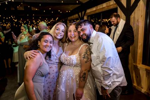 Candid guest celebration at Nuzzo’s Farm wedding by Vanessa Trettel, CT Wedding Photographer serving NY'