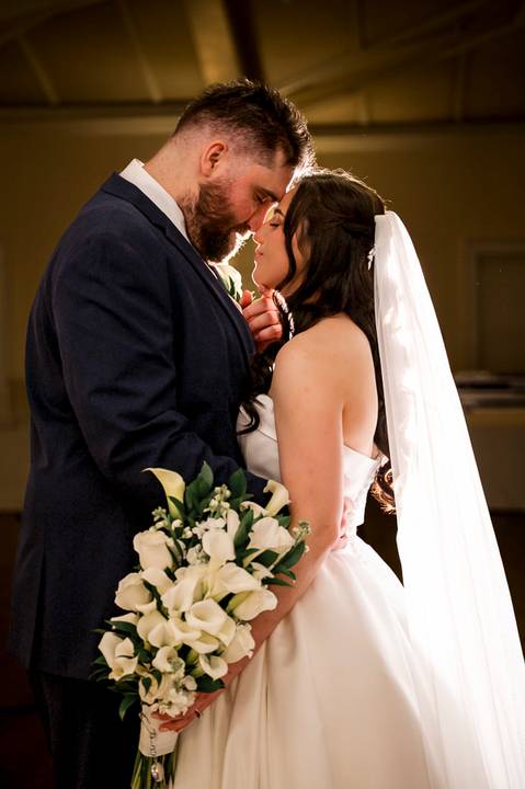 Intimate and romantic portrait of Nick and Emina inside the castle, showcasing how Vanessa Trettel Photography captures beauty even on a rainy wedding day.'