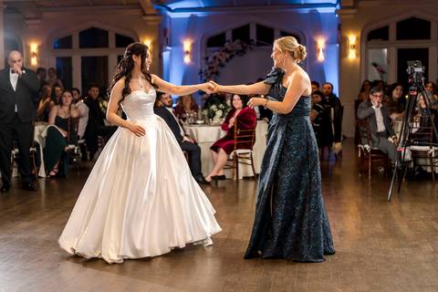 Touching moment as the bride dances with her mother, capturing family love at a Whitby Castle wedding by Vanessa Trettel Photography.'