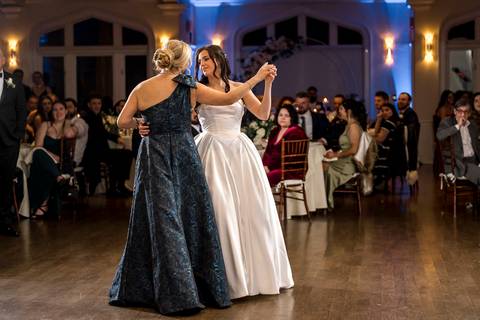 Touching moment as the bride dances with her mother, capturing family love at a Whitby Castle wedding by Vanessa Trettel Photography.'