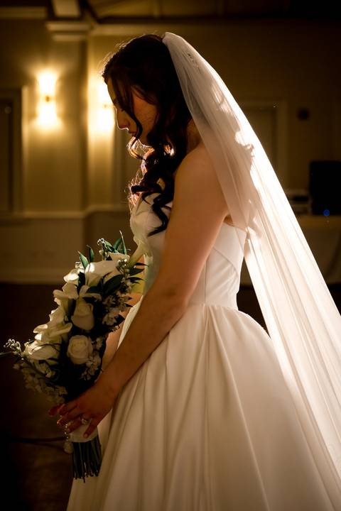The bride looking radiant moments before walking down the aisle, classic bridal portraiture at Whitby Castle by Vanessa Trettel Photography.'