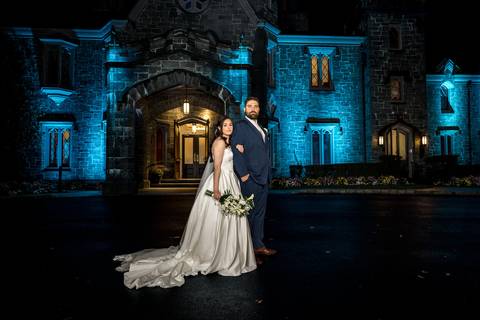 Fashion-forward night wedding photography featuring Nick and Emina outside Whitby Castle in Rye NY, captured by Vanessa Trettel Photography.'