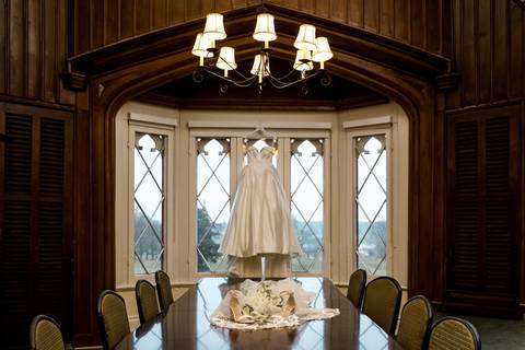 Close-up of the wedding dress texture and floral arrangements, artistic detail shots captured by NY Wedding Photographer Vanessa Trettel Photography.'