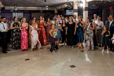 Alison laughing after the successful bouquet toss.
Vanessa Trettel Photography
Wedding photo at Anthony's Ocean View | New Haven CT '