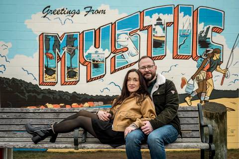 The couple sharing a laugh on a glistening, wet street in Mystic under gray skies.
Vanessa Trettel Photography
engagement photo at Mystic CT'