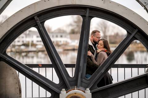 Wide shot of the engaged couple walking across the bridge with the gray Mystic River behind them.
Vanessa Trettel Photography
engagement photo at Mystic CT'