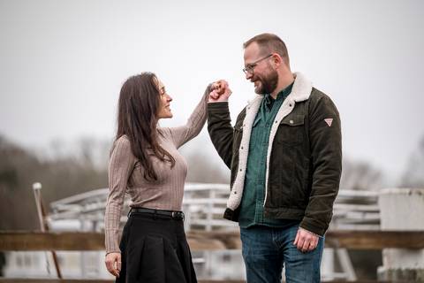Amelia and Kenneth holding each other close with the gray marina stretching behind them.
Vanessa Trettel Photography
engagement photo at Mystic CT'