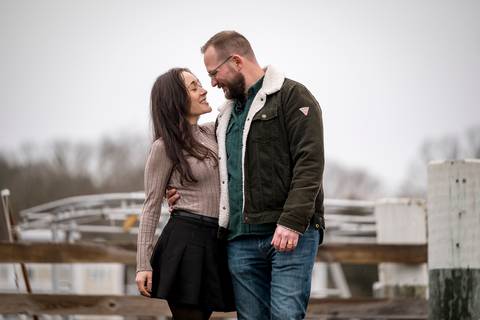 Wide shot of the couple on the pier, highlighting the cinematic, overcast winter sky.
Vanessa Trettel Photography
engagement photo at Mystic CT'