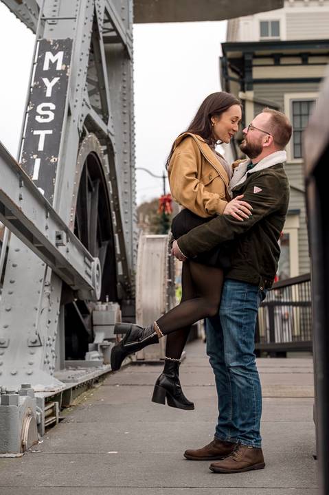 Amelia laughing while Kenneth holds her close on the wet wooden planks of the Mystic bridge.
Vanessa Trettel Photography
engagement photo at Mystic CT'