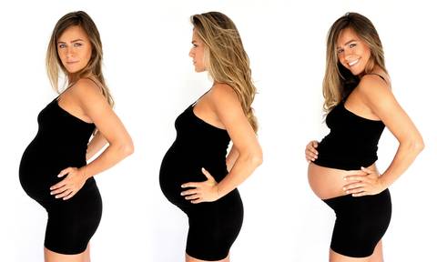 mulher loira, grávida com roupa preta.'