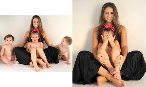 mulher cabelos longos, calça preta, com filhos.'