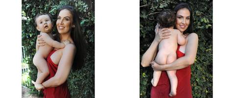 mulher com vestido vermelho e filho no colo'