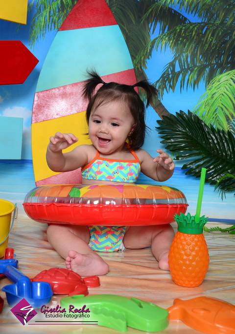Verão praia sol mar biquíni boia bebê acompanhamento mensal brincadeiras'