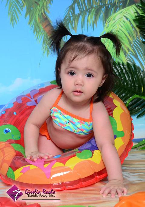 Verão praia sol mar biquíni boia bebê acompanhamento mensal brincadeiras'