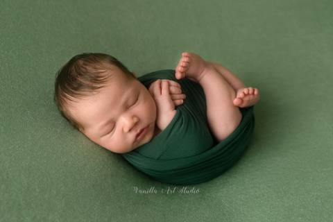 baby lying on his back '