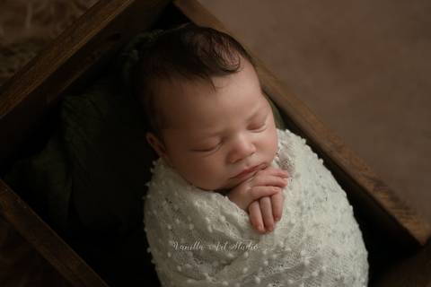 baby sleeping in a box'