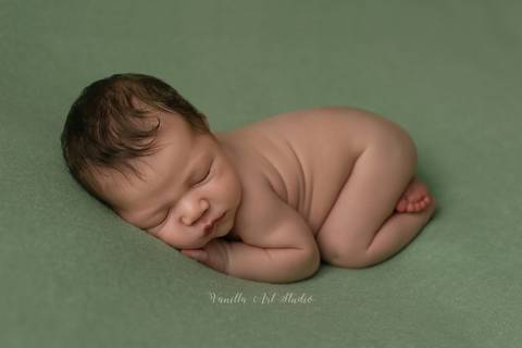 baby lying on his tummy '