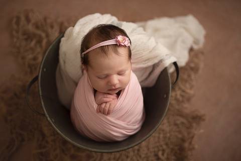 baby girl in a bucket'