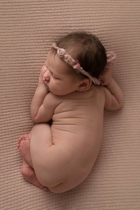 back pose newborn girl'
